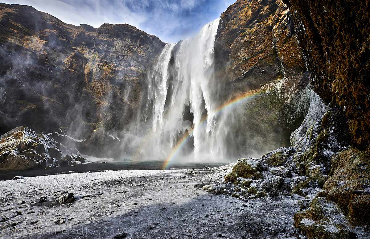 Skogafoss, waterfall, winter, rainbow, ice, frozen, south coast, Holt lodge, cottage, Iceland